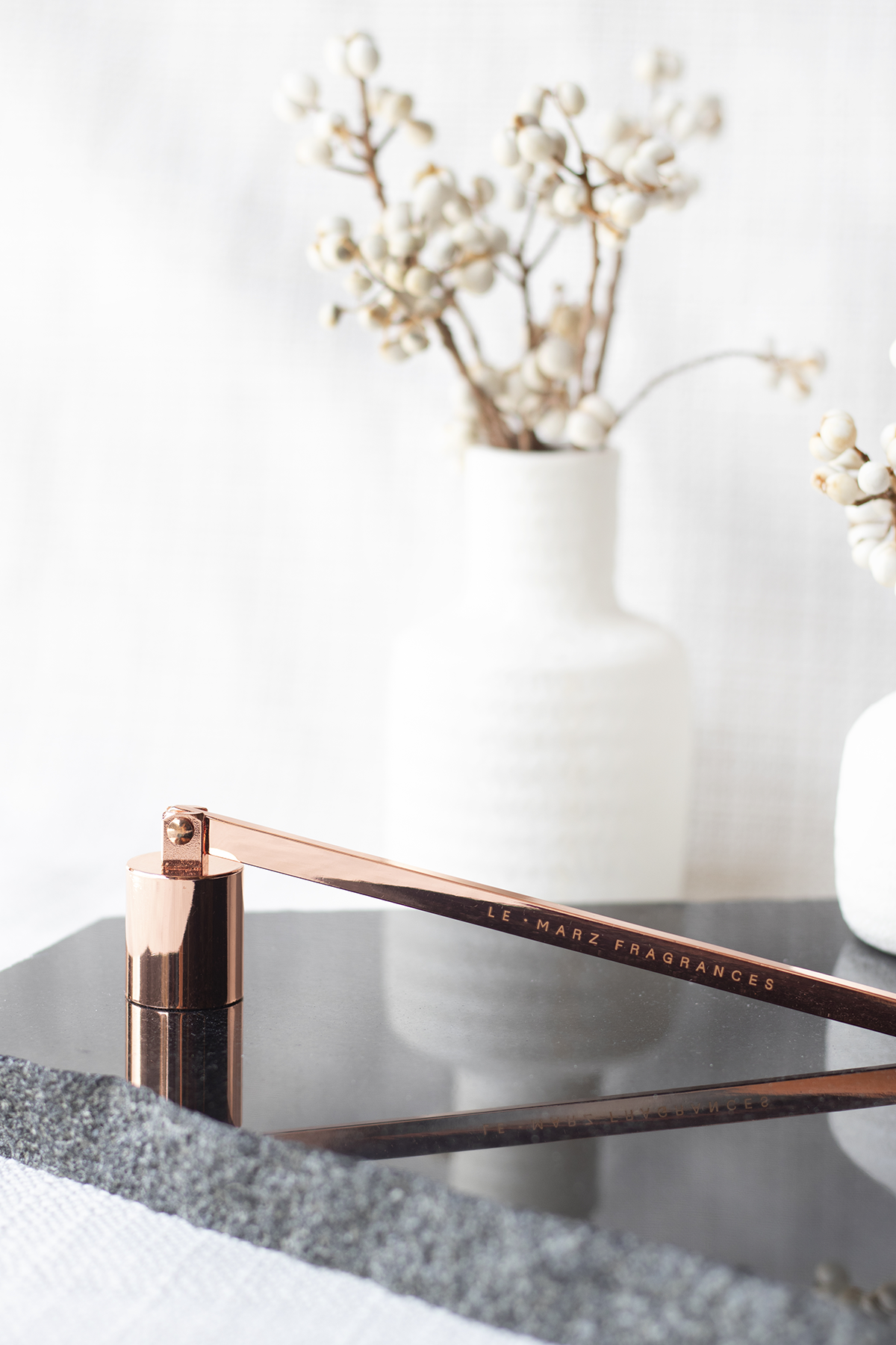 Champagne Rose Gold coloured candle snuffer for candle care.