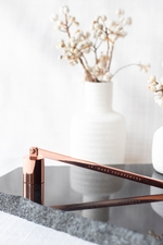 Load image into Gallery viewer, Champagne Rose Gold coloured candle snuffer for candle care.

