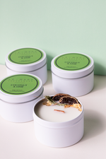 Load image into Gallery viewer, Coconut and Lime sensory mini travel tin wood wick candle with dehydrated botanicals. Fresh, fruity and floral scented candle for gift or home decor or home fragrances
