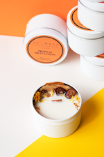 Load image into Gallery viewer, ‘Sensory Collection’ is our miniature wood wick candle range. Mini travel tin wood wick candle with dehydrated botanicals aesthetics. Fresh, fruity and floral scented candle for gift or home decor or home fragrances. Tropical Fruit Fusion candle

