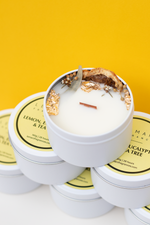 Load image into Gallery viewer, ‘Sensory Collection’ is our miniature wood wick candle range. Mini travel tin wood wick candle with dehydrated botanicals aesthetics. Fresh, fruity and floral scented candle for gift or home decor or home fragrances. Lemon, Eucalyptus and Tea Tree candle
